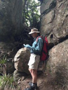 Tony Climie working on a bait line near Te Whara (Bream Rock)